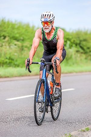 Mike Bosomwoth on the cycling leg of his UK Triathlon