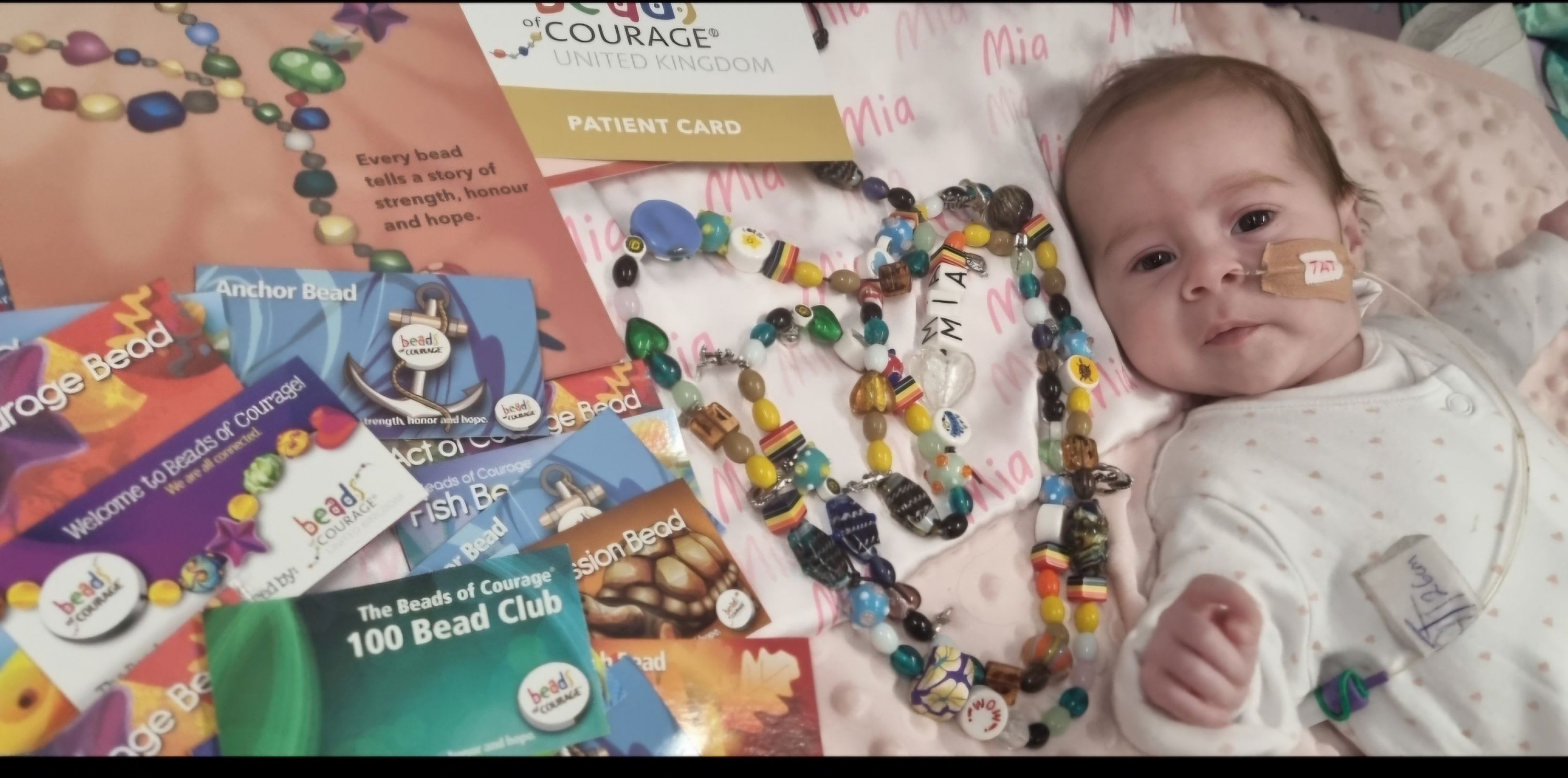 Mia with her Beads of Courage her parents have collected