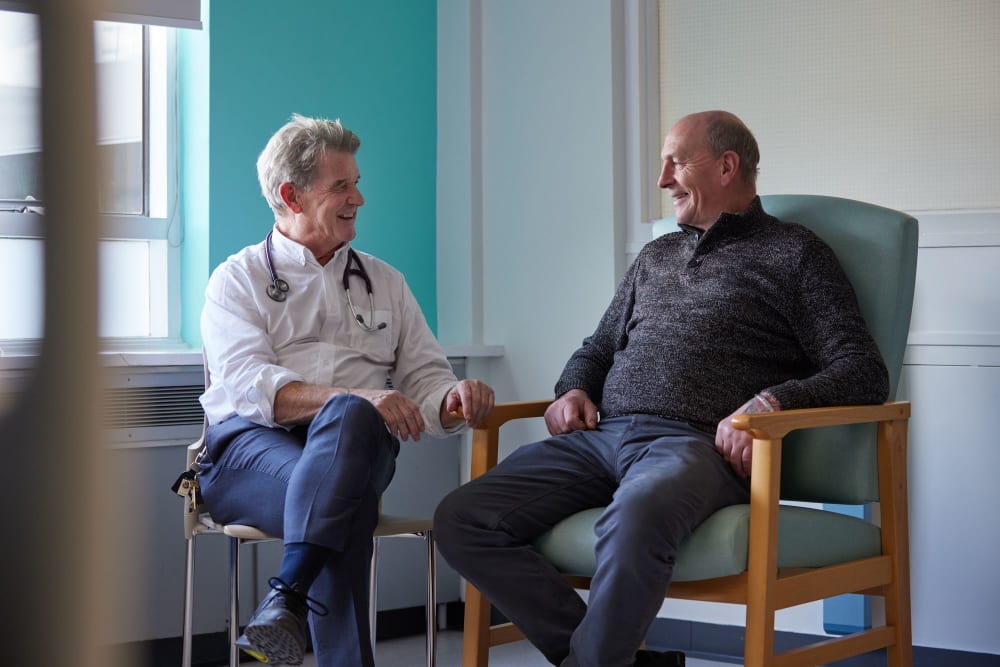 Professor Paul Emery chats with a patient in the stroke and arthritis clinic at Chapel Allerton Hospital